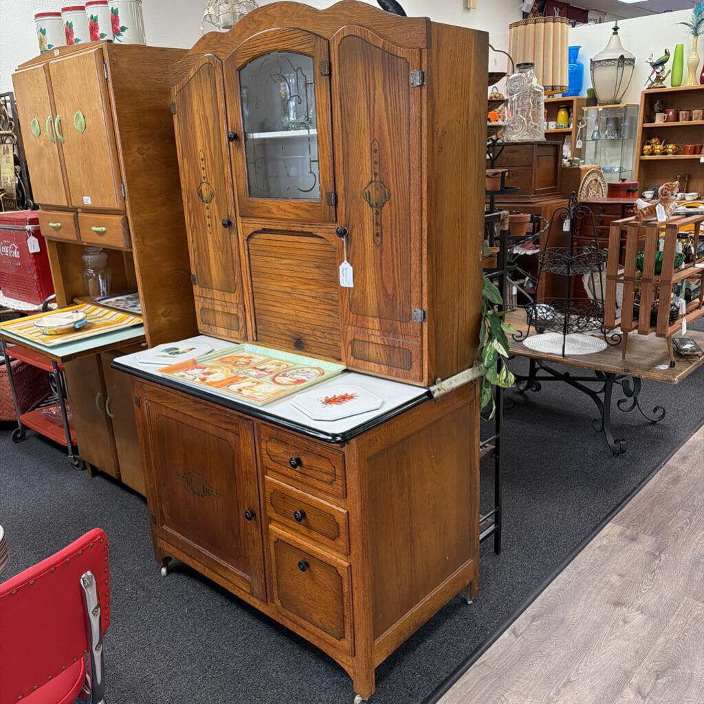 Porcelain top Hoosier style cabinet with accordion roll up door