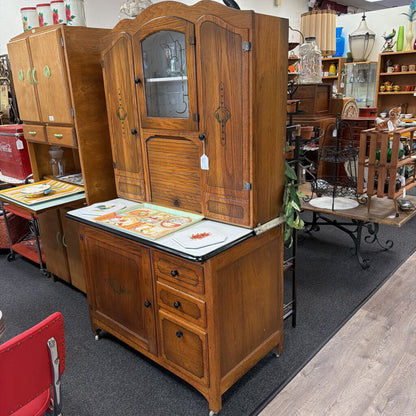 Porcelain top Hoosier style cabinet with accordion roll up door