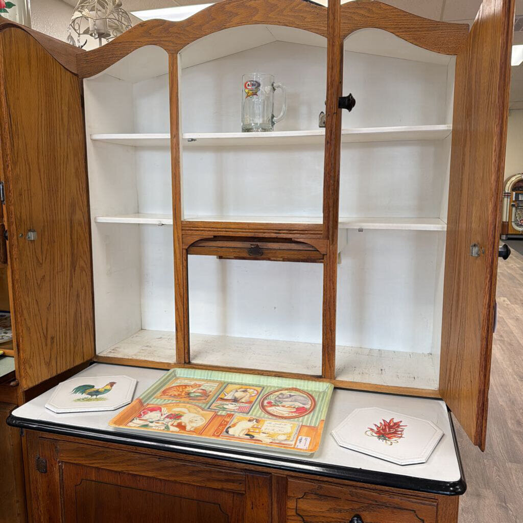 Porcelain top Hoosier style cabinet with accordion roll up door