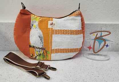 MENDED WING - Orange Parakeet Crescent Tablecloth purse