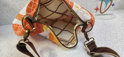 MENDED WING - Orange Parakeet Crescent Tablecloth purse